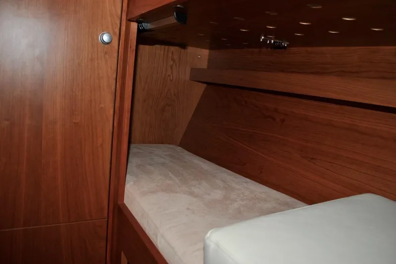 First Light Yacht Photos Pics Interior cabin of 2017 Hanse 505 yacht with wooden finish and cozy bed.