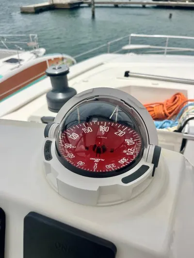 Sea Dog Yacht Photos Pics Compass on a 2023 Bali 4.6 yacht, docked at a marina.