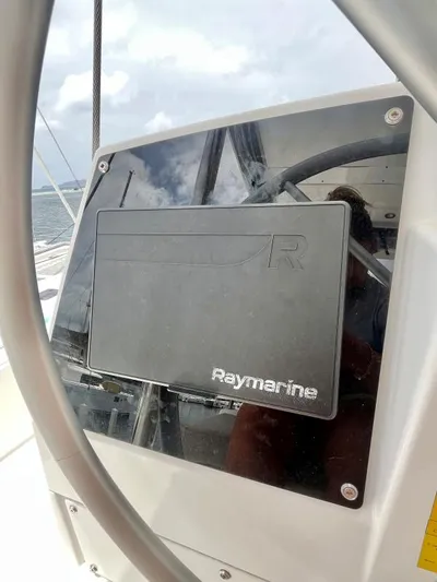 Sea Dog Yacht Photos Pics Raymarine navigation system on 2023 Bali 4.6 yacht, with ocean view in background.