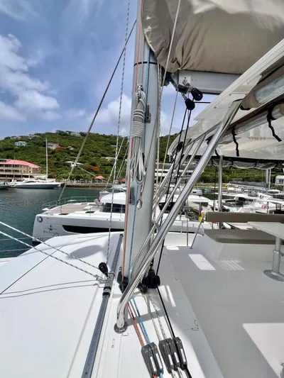 Sea Dog Yacht Photos Pics 2023 Bali 4.6 catamaran docked in a marina, showcasing rigging and deck details.