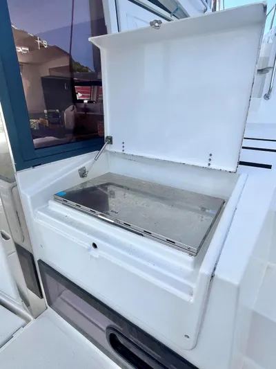 Sea Dog Yacht Photos Pics Outdoor grill on 2023 Bali 4.6 yacht, open lid, sleek design.