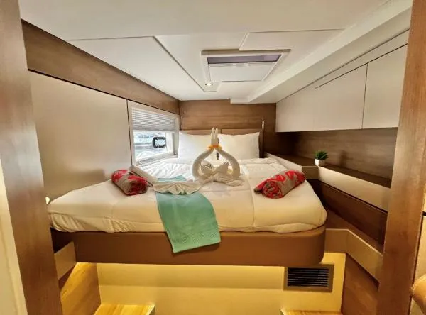 Sea Dog Yacht Photos Pics Luxurious cabin interior of 2023 Bali 4.6 yacht with elegant bedding and decor.