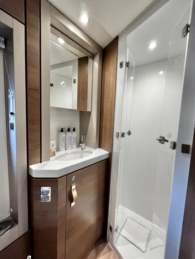 Sea Dog Yacht Photos Pics Modern bathroom in 2023 Bali 4.6 model, featuring sleek design and glass shower enclosure.