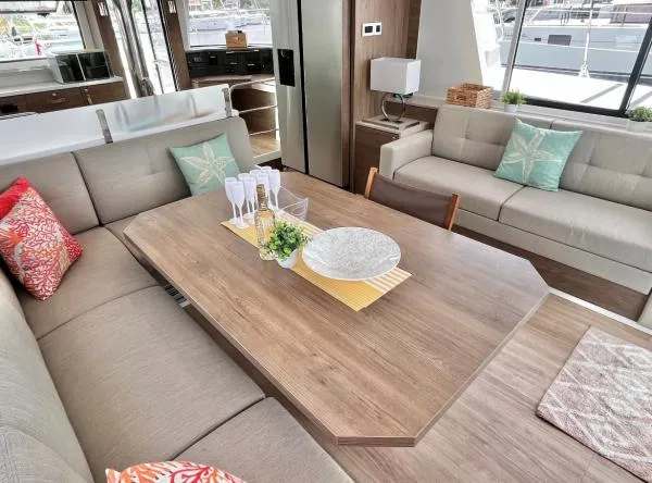 Sea Dog Yacht Photos Pics Luxurious interior of 2023 Bali 4.6 yacht with elegant dining area and comfortable seating.