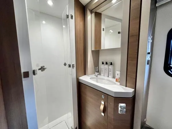 Sea Dog Yacht Photos Pics Modern bathroom in 2023 Bali 4.6 yacht with sleek design and glass shower.