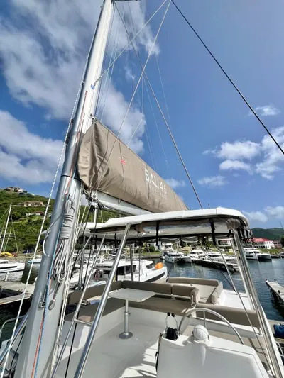 Sea Dog Yacht Photos Pics 2023 Bali 4.6 sailboat docked in a marina under a clear blue sky.