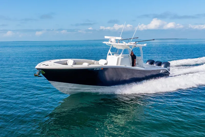  Yacht Photos Pics 2016 Yellowfin 36 Offshore boat cruising on clear blue ocean waters.