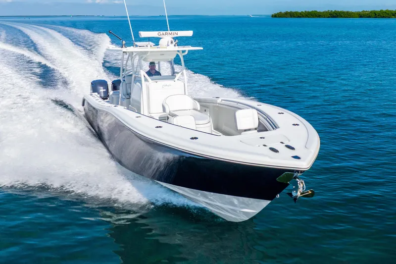  Yacht Photos Pics 2016 Yellowfin 36 Offshore boat cruising on clear blue water.