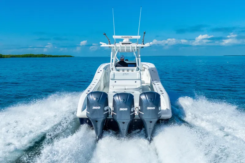 Yacht Photos Pics 2016 Yellowfin 36 Offshore boat cruising on open water with triple engines.