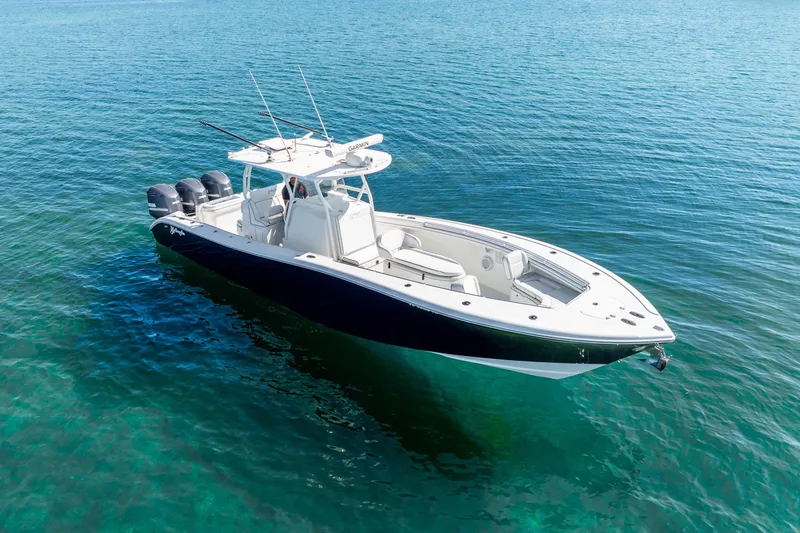  Yacht Photos Pics 2016 Yellowfin 36 Offshore boat on clear blue water, featuring triple outboard engines.