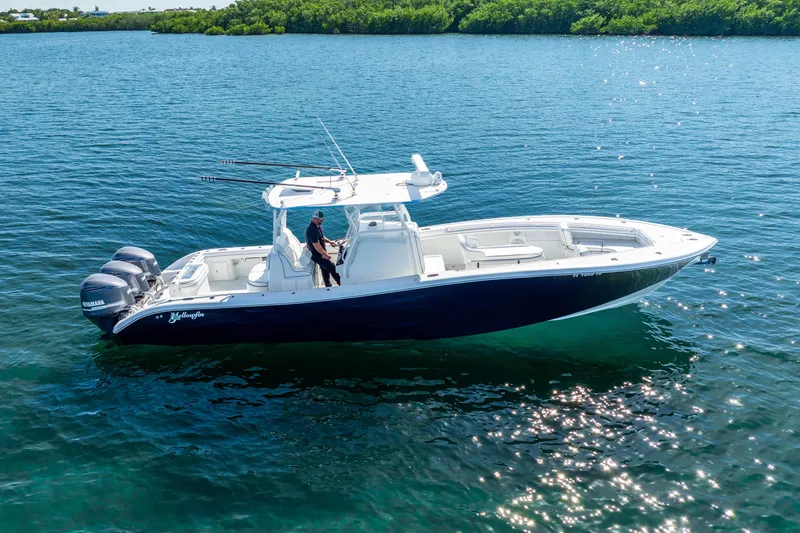  Yacht Photos Pics 2016 Yellowfin 36 Offshore boat on calm water, featuring triple Yamaha engines.