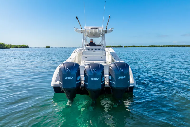 Yacht Photos Pics 2016 Yellowfin 36 Offshore boat with triple Yamaha 300 engines on clear water.