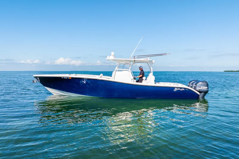  Yacht Photos Pics 2016 Yellowfin 36 Offshore boat on calm blue ocean waters.