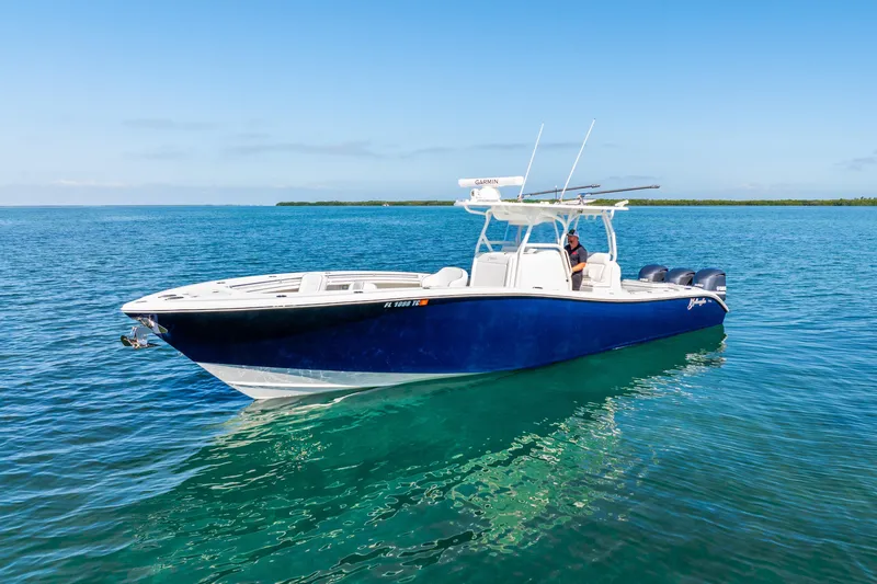  Yacht Photos Pics 2016 Yellowfin 36 Offshore boat on clear blue water, sunny day.