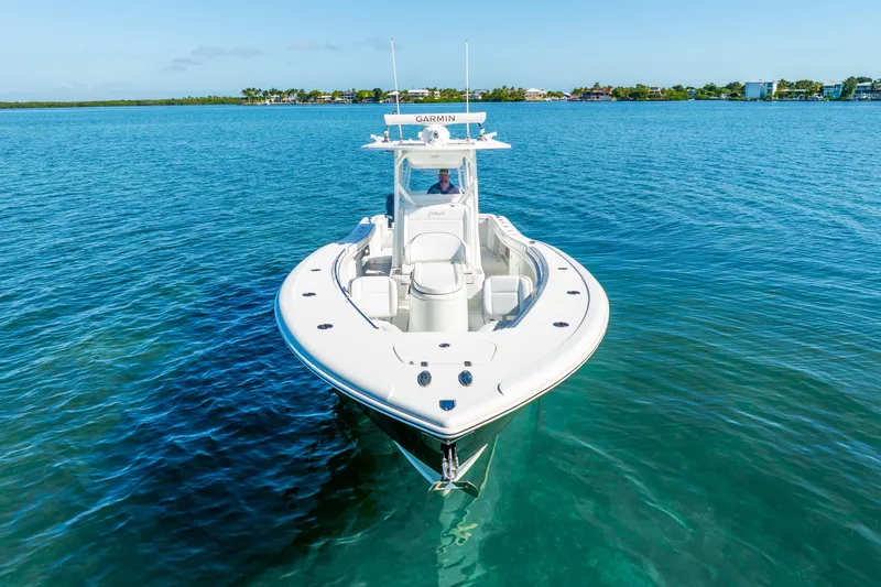  Yacht Photos Pics 2016 Yellowfin 36 Offshore boat on clear blue water, front view.