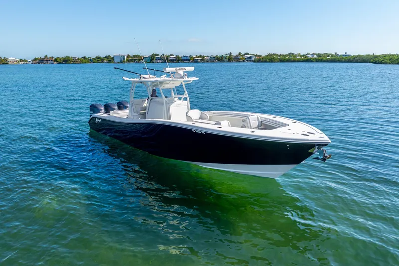  Yacht Photos Pics 2016 Yellowfin 36 Offshore boat on clear blue water, sunny day.