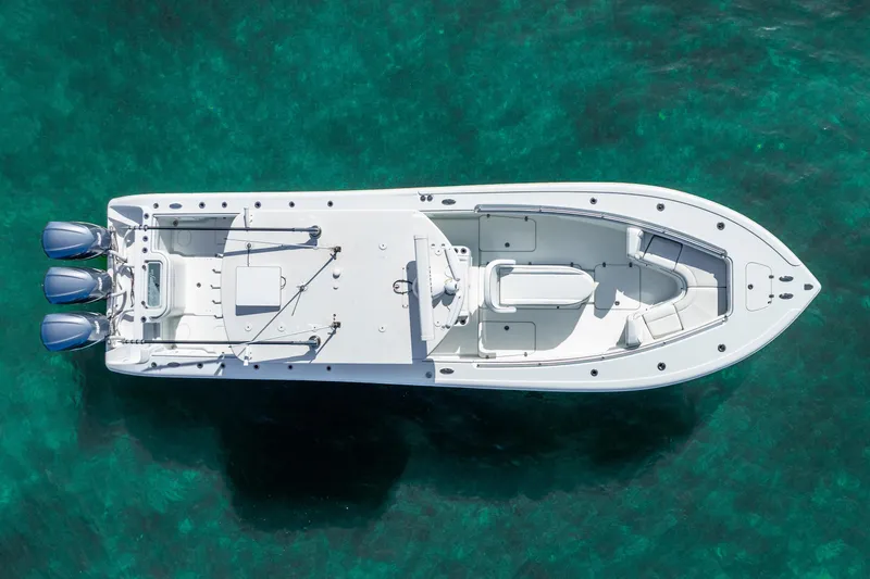  Yacht Photos Pics Aerial view of 2016 Yellowfin 36 Offshore boat on clear turquoise water.