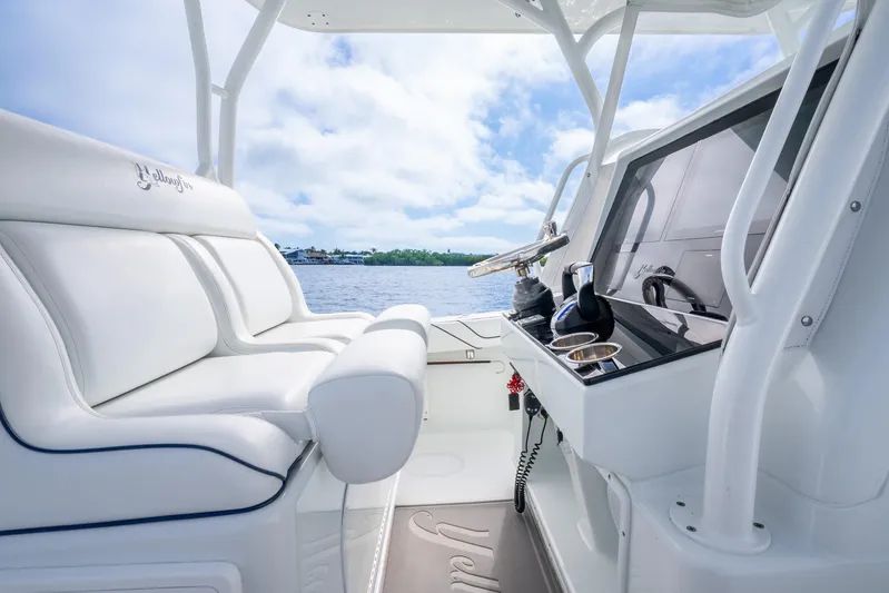  Yacht Photos Pics 2016 Yellowfin 36 Offshore boat interior with white seating and modern helm.