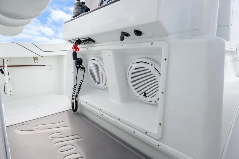  Yacht Photos Pics 2016 Yellowfin 36 Offshore boat interior with speakers and communication equipment.