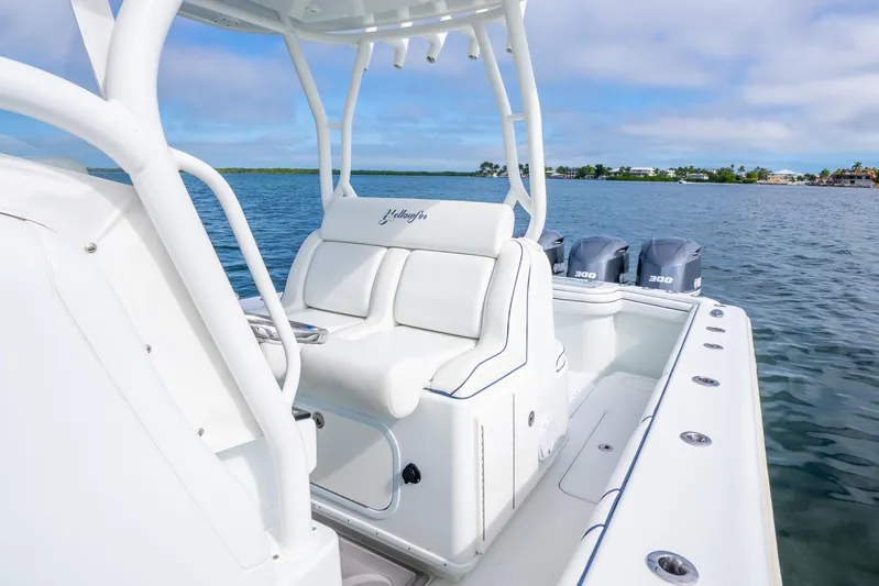  Yacht Photos Pics 2016 Yellowfin 36 Offshore boat with triple engines on calm water.