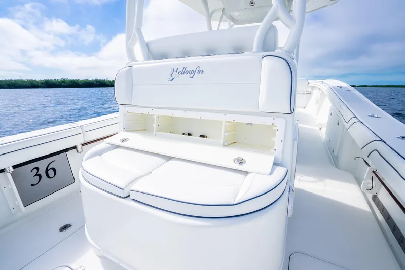  Yacht Photos Pics 2016 Yellowfin 36 Offshore boat interior with seating and storage, on calm water.