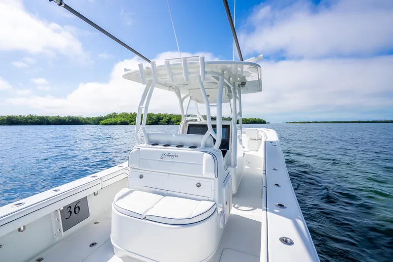  Yacht Photos Pics 2016 Yellowfin 36 Offshore boat on calm water under blue sky.