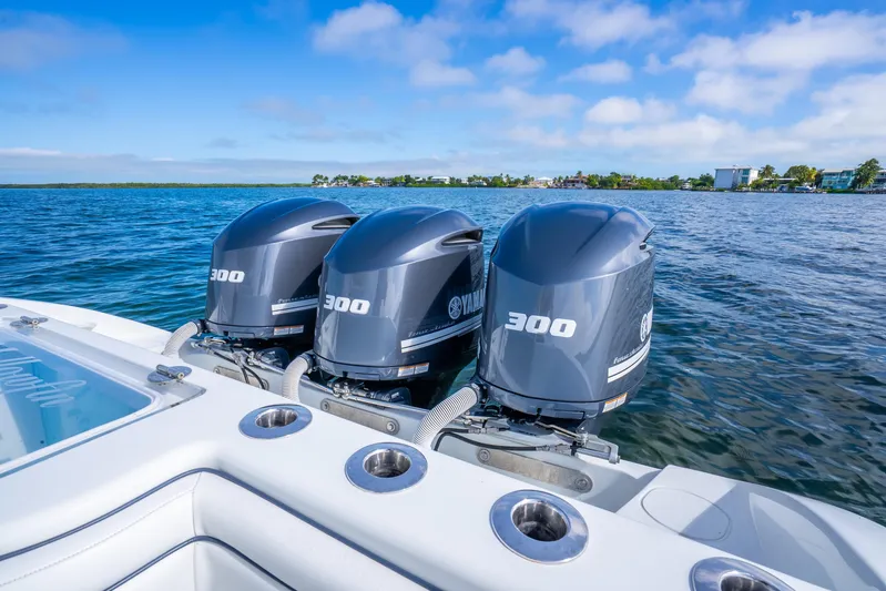  Yacht Photos Pics 2016 Yellowfin 36 Offshore boat with triple Yamaha 300 engines on open water.