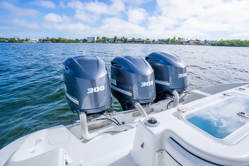  Yacht Photos Pics 2016 Yellowfin 36 Offshore boat with triple 300 horsepower engines on water.