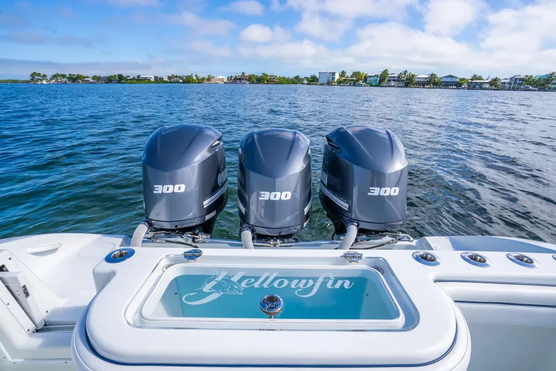  Yacht Photos Pics 2016 Yellowfin 36 Offshore boat with triple 300 horsepower engines on open water.