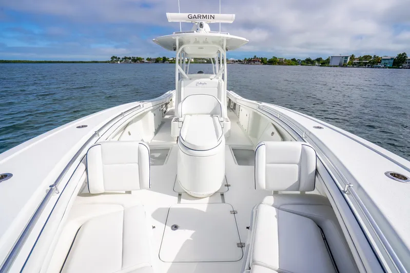  Yacht Photos Pics 2016 Yellowfin 36 Offshore boat with spacious deck and seating on calm water.