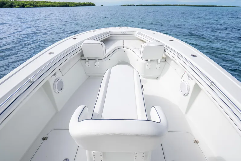  Yacht Photos Pics 2016 Yellowfin 36 Offshore boat interior with white seating on calm water.