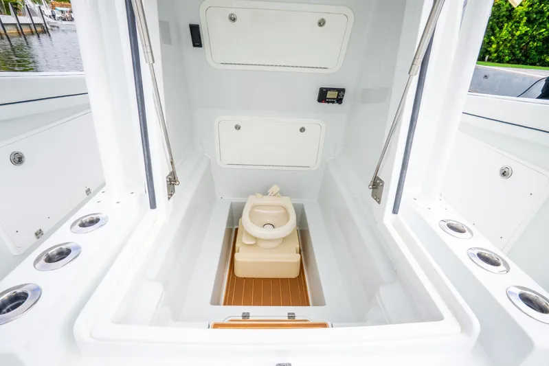  Yacht Photos Pics 2016 Yellowfin 36 Offshore boat interior with compact marine toilet.