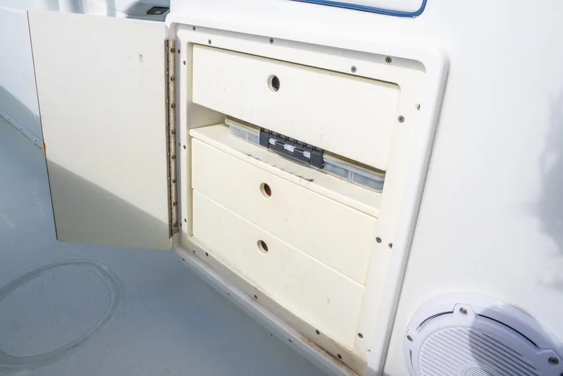  Yacht Photos Pics Open storage compartment on 2016 Yellowfin 36 Offshore boat, featuring three drawers.