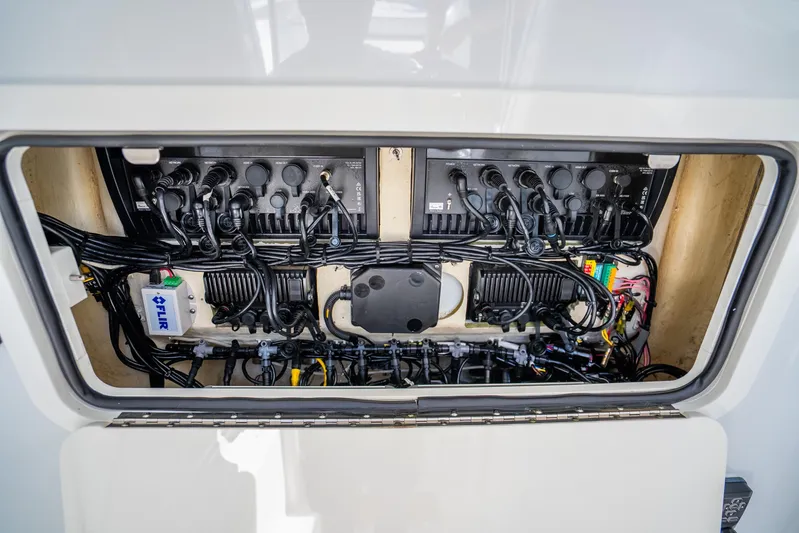  Yacht Photos Pics Electrical system inside a 2016 Yellowfin 36 Offshore boat, showcasing wiring and components.