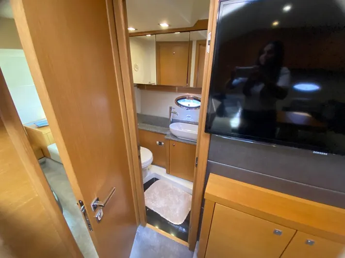  Yacht Photos Pics Interior of 2014 Sunseeker 48 Portofino XPS yacht, featuring bathroom and modern wood cabinetry.