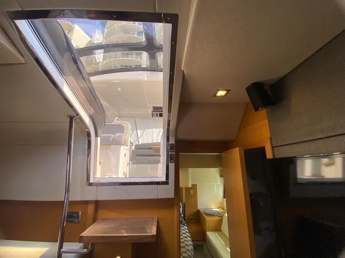  Yacht Photos Pics Interior view of 2014 Sunseeker 48 Portofino XPS yacht, featuring modern design and natural lighting.