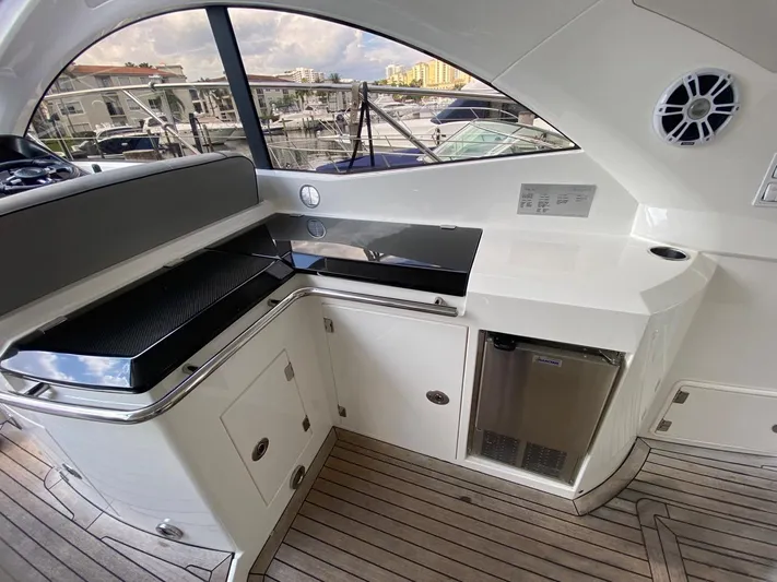  Yacht Photos Pics Luxurious 2014 Sunseeker 48 Portofino XPS yacht interior with sleek kitchenette and modern amenities.