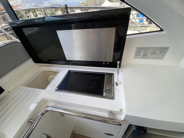  Yacht Photos Pics Sunseeker 48 Portofino XPS 2014 yacht interior with built-in grill and sink.