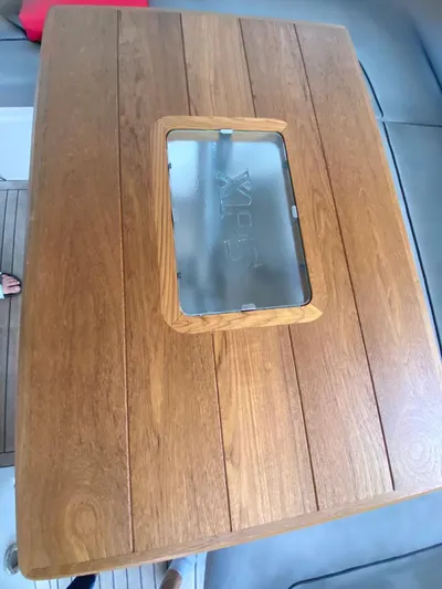  Yacht Photos Pics Wooden table with glass insert on 2014 Sunseeker 48 Portofino XPS yacht.