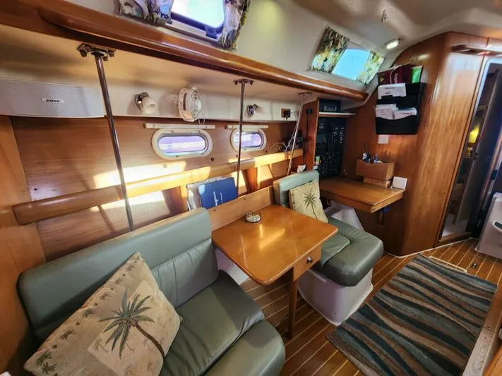Soleyah Yacht Photos Pics Interior of 2007 Catalina 387 sailboat with cozy seating and wooden accents.