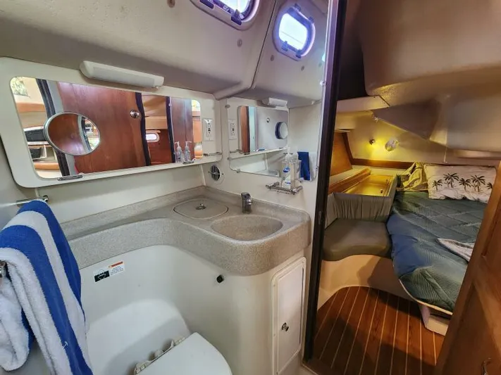 Soleyah Yacht Photos Pics Catalina 387 yacht interior, featuring bathroom and cozy sleeping area, 2007 model.