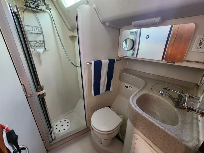 Soleyah Yacht Photos Pics Catalina 387 yacht bathroom, featuring shower, toilet, and sink, 2007 model.