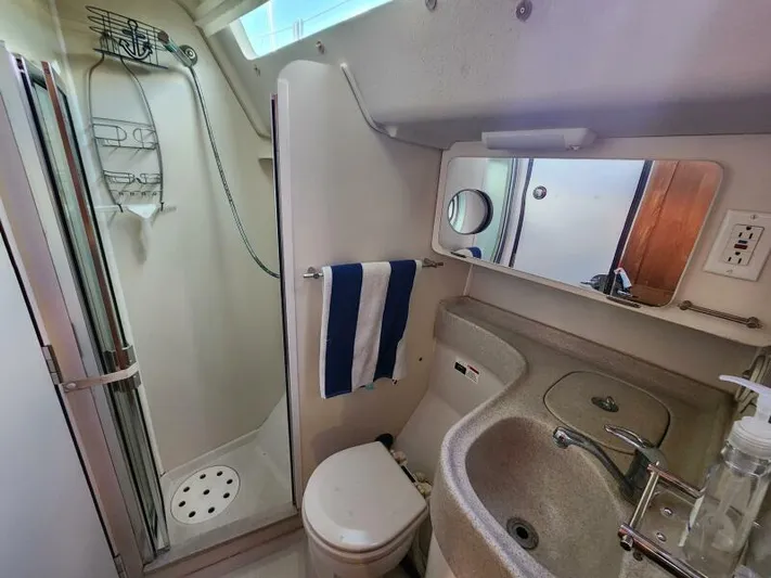 Soleyah Yacht Photos Pics Compact bathroom in 2007 Catalina 387 yacht with shower, sink, and toilet.