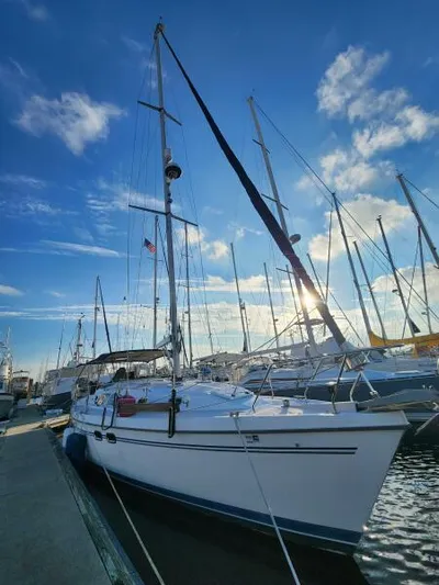 Soleyah Yacht Photos Pics 2007 Catalina 387 sailboat docked under a vibrant blue sky.