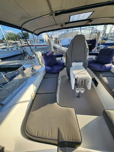 Soleyah Yacht Photos Pics 2007 Catalina 387 sailboat cockpit with cushioned seating and covered helm.