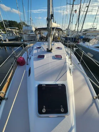 Soleyah Yacht Photos Pics 2007 Catalina 387 sailboat docked in marina, clear sky, multiple boats in background.