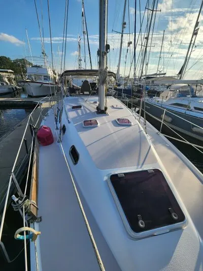 Soleyah Yacht Photos Pics 2007 Catalina 387 sailboat docked in a marina, surrounded by other boats.