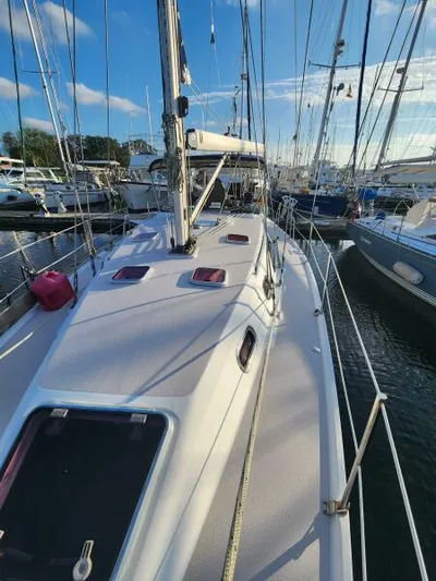Soleyah Yacht Photos Pics Catalina 387 sailboat, 2007 model, docked in a marina under a clear blue sky.