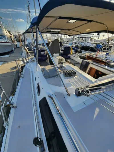 Soleyah Yacht Photos Pics 2007 Catalina 387 sailboat docked at marina, featuring spacious deck and canopy.