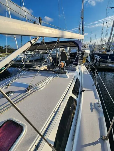 Soleyah Yacht Photos Pics 2007 Catalina 387 sailboat docked in marina under clear blue sky.